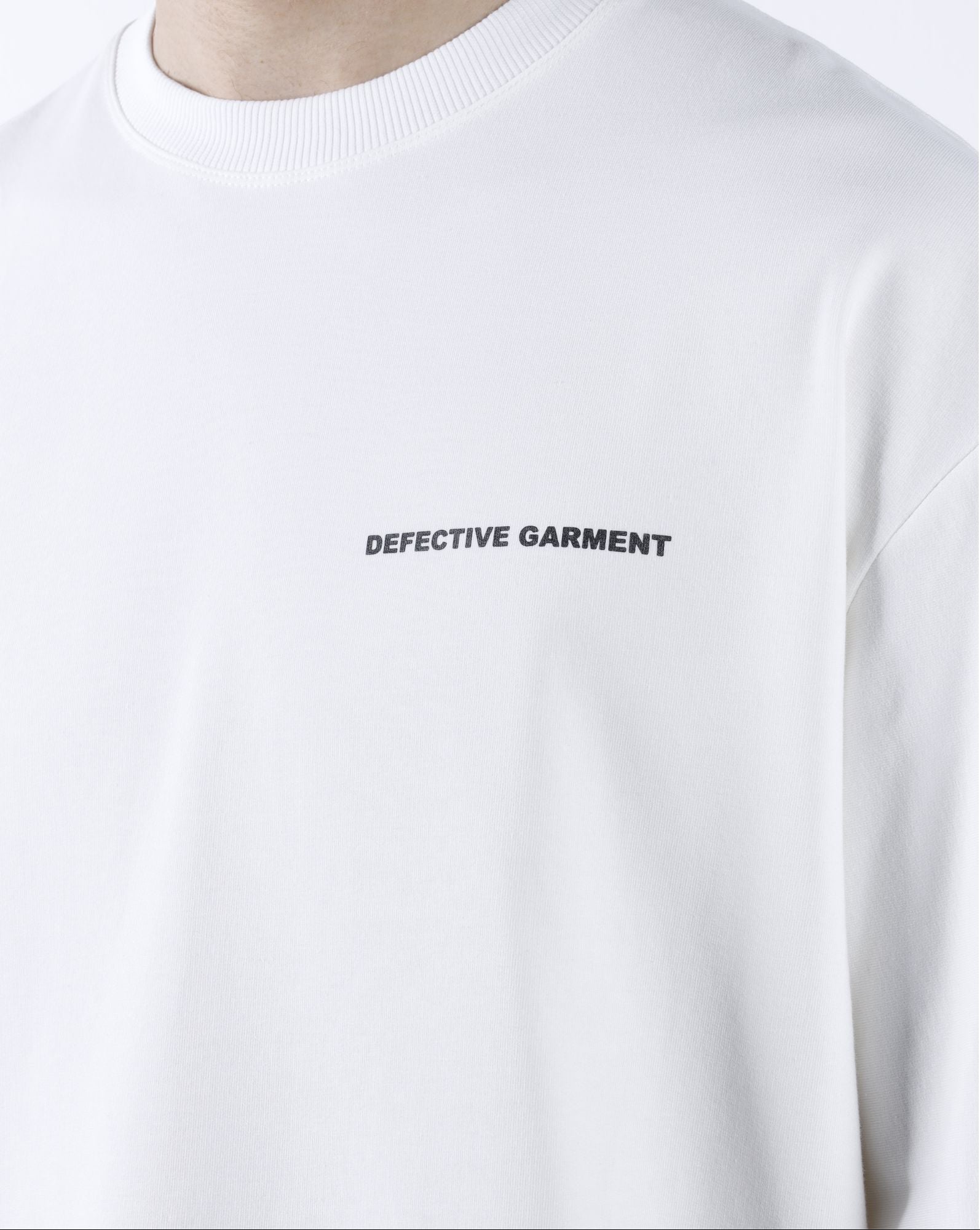 White "Defective Garment"  T-Shirt